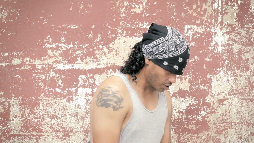 Gangster thug yelling at camera flashing gang signs 