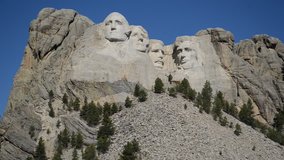 Mount Rushmore National Memorial, symbol of America located in the Black Hills, South Dakota, USA. Image with blue space for added text or for presentations. HD video