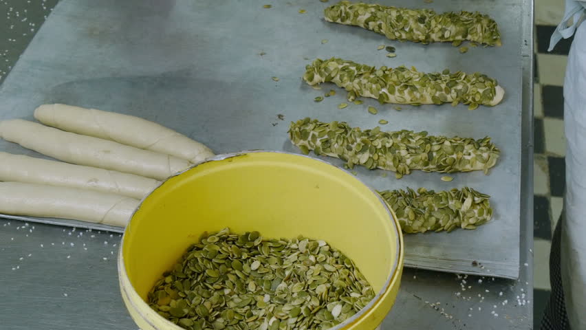 A german baker prepare special roll buns - 4k 11694
