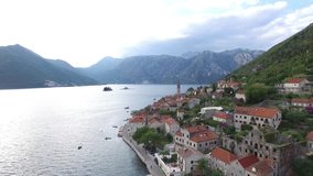 Aerial survey in Perast in Montenegro in the Bay of Kotor on a cloudy day. The mountains and canyons of Montenegro. Flight to quadrocopters DJI Phantom. Perast bird's-eye view