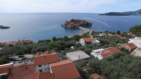The island of Sveti Stefan from the height of bird flight. Aerial photography in Montenegro. Flights to quadrocopters DJI Phantom 3 Professional. Shooting in 4K. Flying over the island