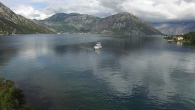 A big yacht moored in the Bay of Kotor near the town of Morinj. Aerial photography in Montenegro, in the Bay of Kotor. Flying over water. Flights to quadrocopters DJI Phantom 3 Professional 4k