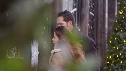 4K Attractive romantic couple shopping together at Christmas time. Shot on RED Epic.