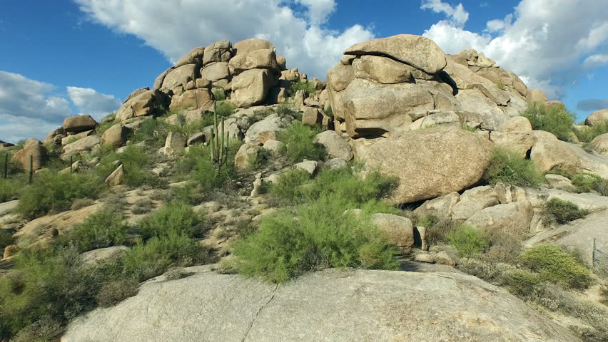 Aerial: Fly over boulders in Arizona