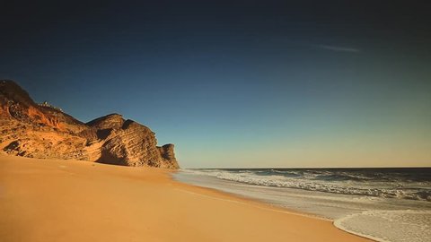 Cinemagraph loop - Ocean waves breaking on a Desert beach. motion photo