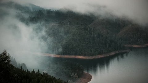 Cinemagraph Loop - View of a lake covered in fog during morning sunrise. Motion photo