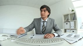 Video of handsome manager working in office 