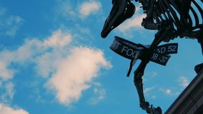 A timelapse view of the London Stock Exchange Ticker attached to the Gift Horse statue in London, UK, against a backdrop of moving clouds - Powered by Shutterstock - Get 15% off with code: PIKWIZARD15