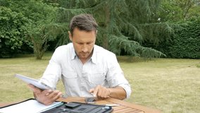 Man working with electronic tablet at home