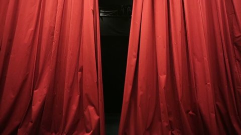 Opening red curtain in a theater