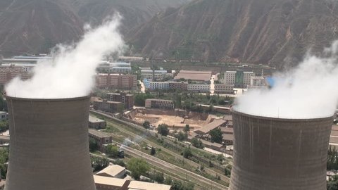A coal fired powerplant stands in the middle of a residential area in the Chinese provincial capital of Lanzhou. 