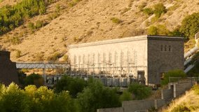 Hydropower Station on the Hillside. A great piece of stock footage filmed in 4k definition, perfect for film, tv, documentaries, reality TV, trailers, infomercials and more!