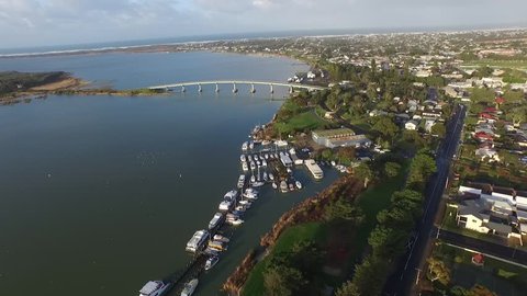Aerial footage elevated view of hindmarsh island bridge goolwa south australia. River Murray. Famous for secret womans business aboriginal issues. Wharf, oscar w steam boat south Australian holidays.
