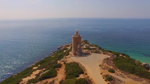 Marvelous Aerial View from a Drone Flying Over Spanish Beach with Lighthouse and Cliffs