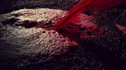 Production footage of red wine being poured into wine vat with winemaker testing and tasting red wine in winery cellar after vintage and harvest. Include Barossa, Clare, Hunter, Tanunda, Yarra, Valley