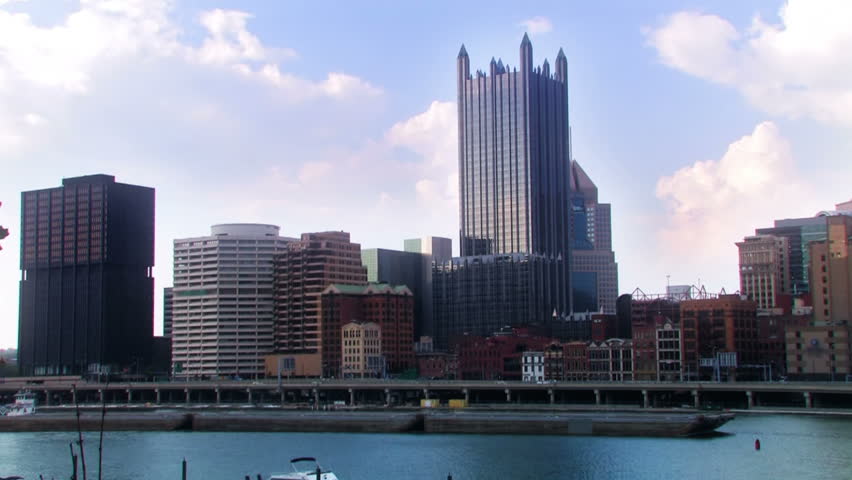 A coal barge passes the city of Pittsburgh, Pennsylvania.