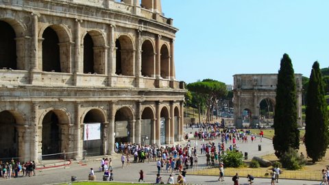 ROME, ITALY - JULY 11, 2015: Crowd of people in front of Colosseum during the day. Standing in the line to the popular landmark in country