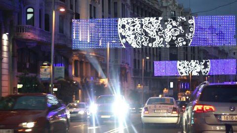 MADRID, SPAIN 06 DECEMBER 2014; Traffic and lights on the streets of Madrid, Christmas decorated Gran via