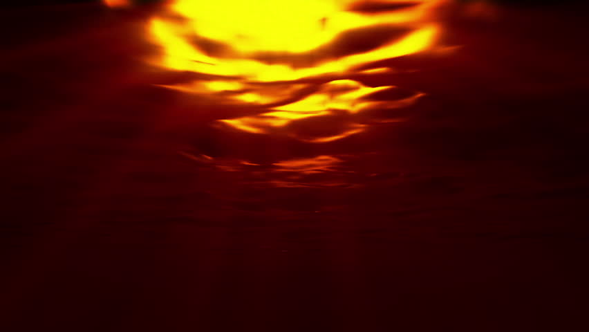 Underwater at sunset, sun reflecting on surface