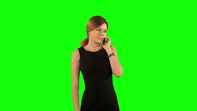 Portrait of smiling business woman phone talking on a Green Screen, Chroma Key. Professional shot on BMCC RAW with high dynamic range. You can use it e.g in your commercial video, business video