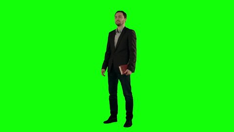 young student reading a law book  on a Green Screen, Chroma Key. Professional shot on BMCC RAW with high dynamic range. You can use it e.g in your commercial video, business video, office theme.