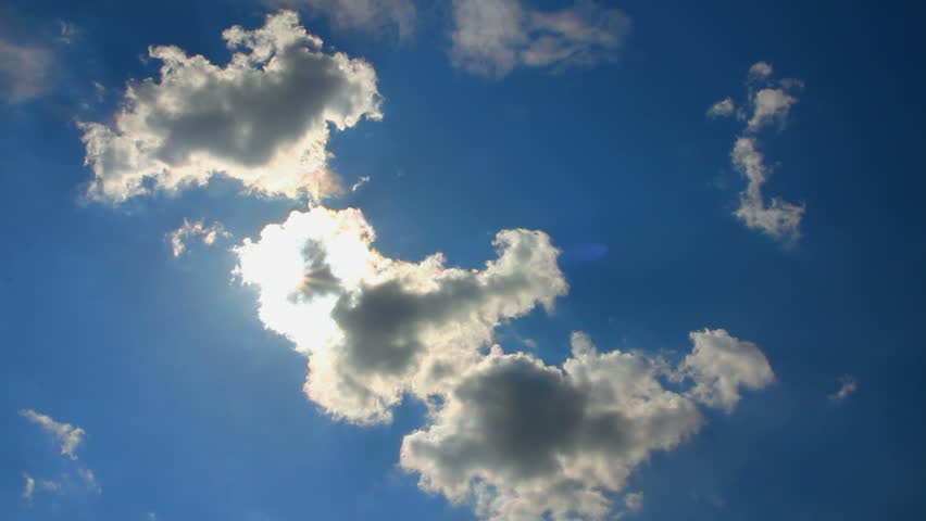clouds and sun on blue sky