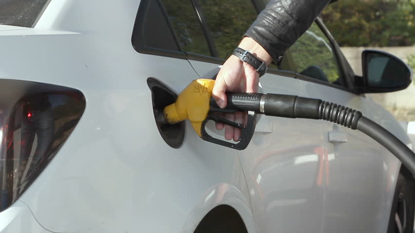 Volgograd, Russian Federation – October 04, 2015: Closeup of man pumping gasoline fuel in car at gas station. | Shutterstock HD Video #12227162