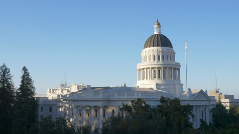 Early morning zooming in and panning view of the California capitol building in downtown Sacramento.