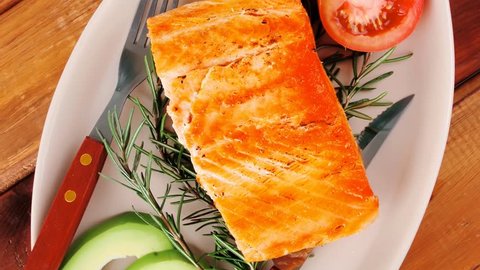 food: grilled salmon on big glass plate on wooden table 1920x1080 intro motion slow hidef hd