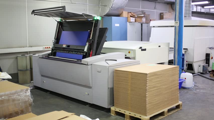 System for loading offset plates into printing machine.