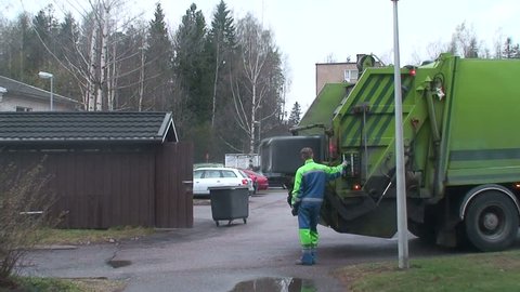 Man operates rubbish collecting machine one 