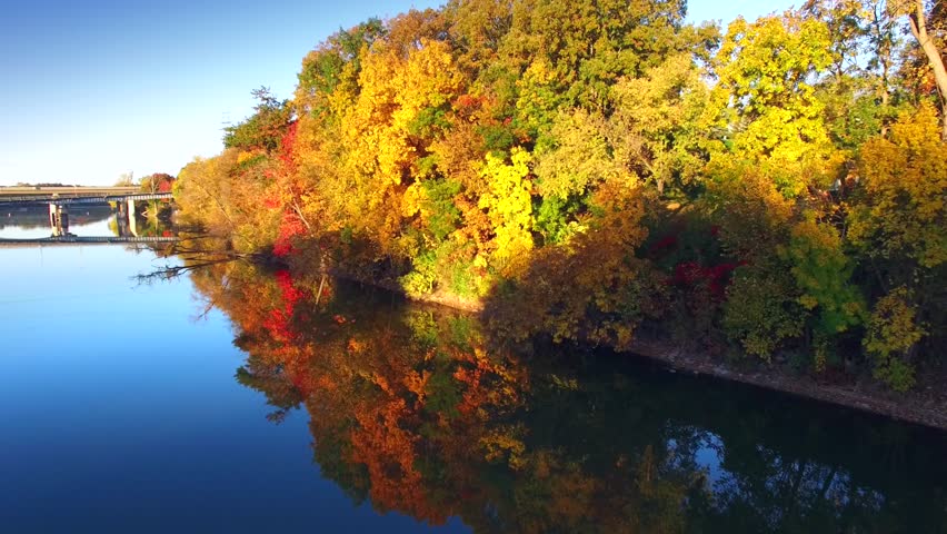 Journey Amid Colorful Autumn Foliage at Rivers Edge.
