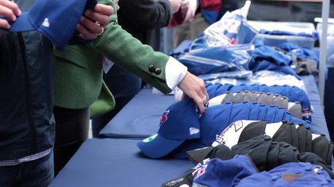 Toronto blue jays hats merchandise close up table - OCTOBER 14TH, 2015 - Toronto World Series Playoffs Game 5 vs Texas Rangers