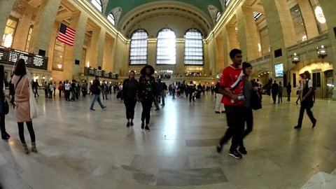 NEW YORK - OCT 15: (4k Timelapse GROUND LEVEL View) Passengers traveling through Grand Central Station in New York, NY often symbolize the busy pace of the city that never sleeps.