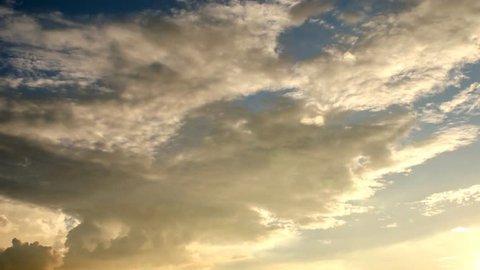 4K UHD Time lapse of clouds with sunset light