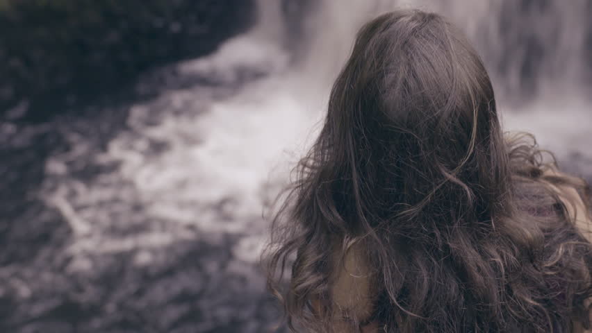 Young Woman Enjoys Watching Waterfall, Back To Camera, Shot In 4K 