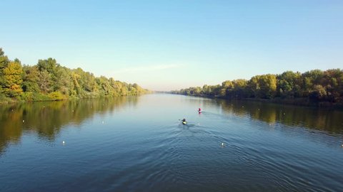Aerial view of two athletes kayaking and canoeing in rowing canal