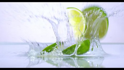 Lime splashing into water in slow motion