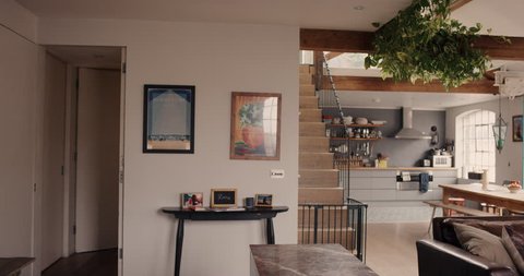 Happy couple walk into their dream home and embrace slow motion steadicam shot