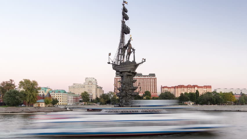 Panoramic view of the monument to Russian emperor Peter the Great, on background of blue sky. Timelapse hyperlapse from day to night transition, Moscow, Russia