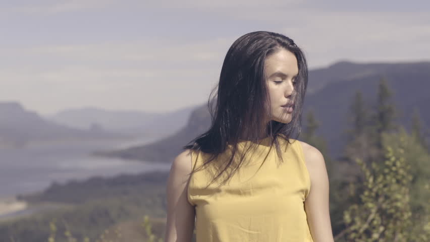 Portrait Of Smiling, Mixed Race Model At Scenic Overlook In Oregon (Slow Motion)