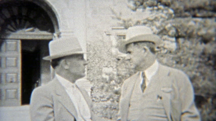 ELYRIA, OHIO. 1937: Elite businessmen in formal fashion dress with fedora hats.