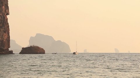 Boats among the Phi Phi islands at sunrise, Thailand.