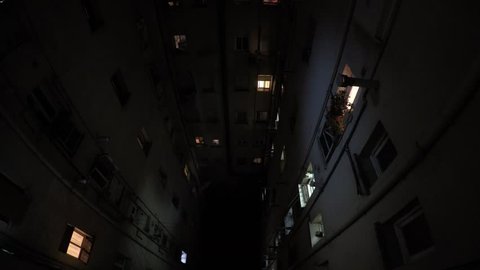 view into a residential building with several lights changing - time-lapse