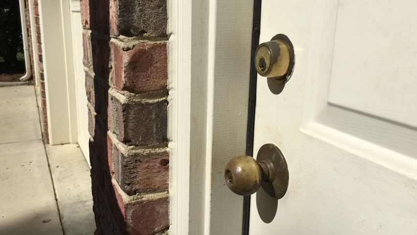 Young Man Unlocking A Deadbolt Stock Footage Video 100 Royalty Free 12289160 Shutterstock