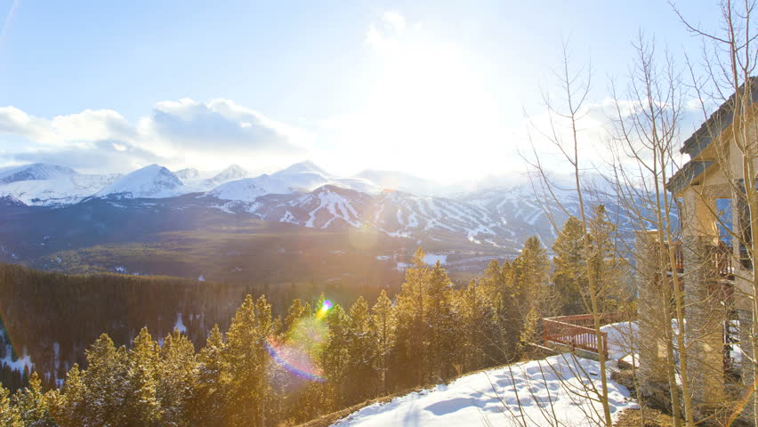 Breckenridge Colorado USA Ski Resort sun flare log cabin trees spruce sunset Rockies snow winter mountain travel vacation climbing hiking time lapse