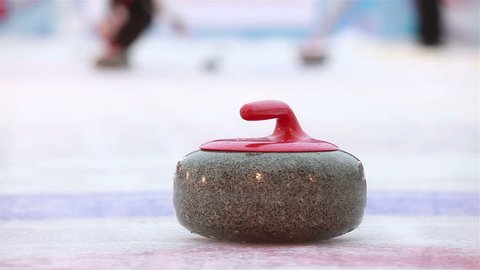 Players curling throw stones on the ice. Stock Video
