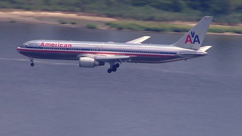 Philadelphia, PA - 2015: American Airlines commercial passenger plane landing at an international airport