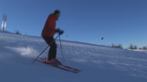 two skiers on flat slope