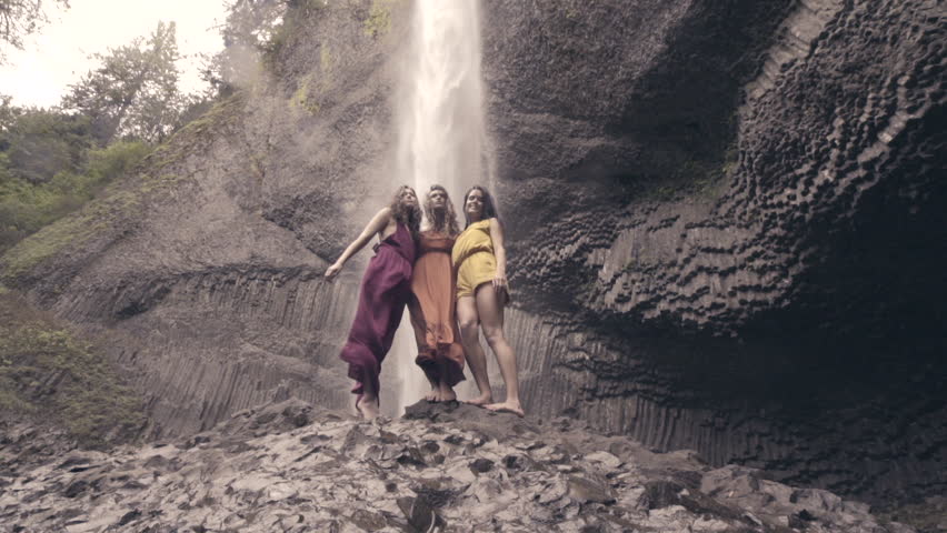 Models Pose On Rocks Below Epic Waterfall In Columbia River Gorge, Oregon (Slow Motion)